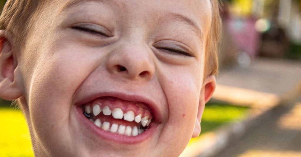 close up photo of boy smiling